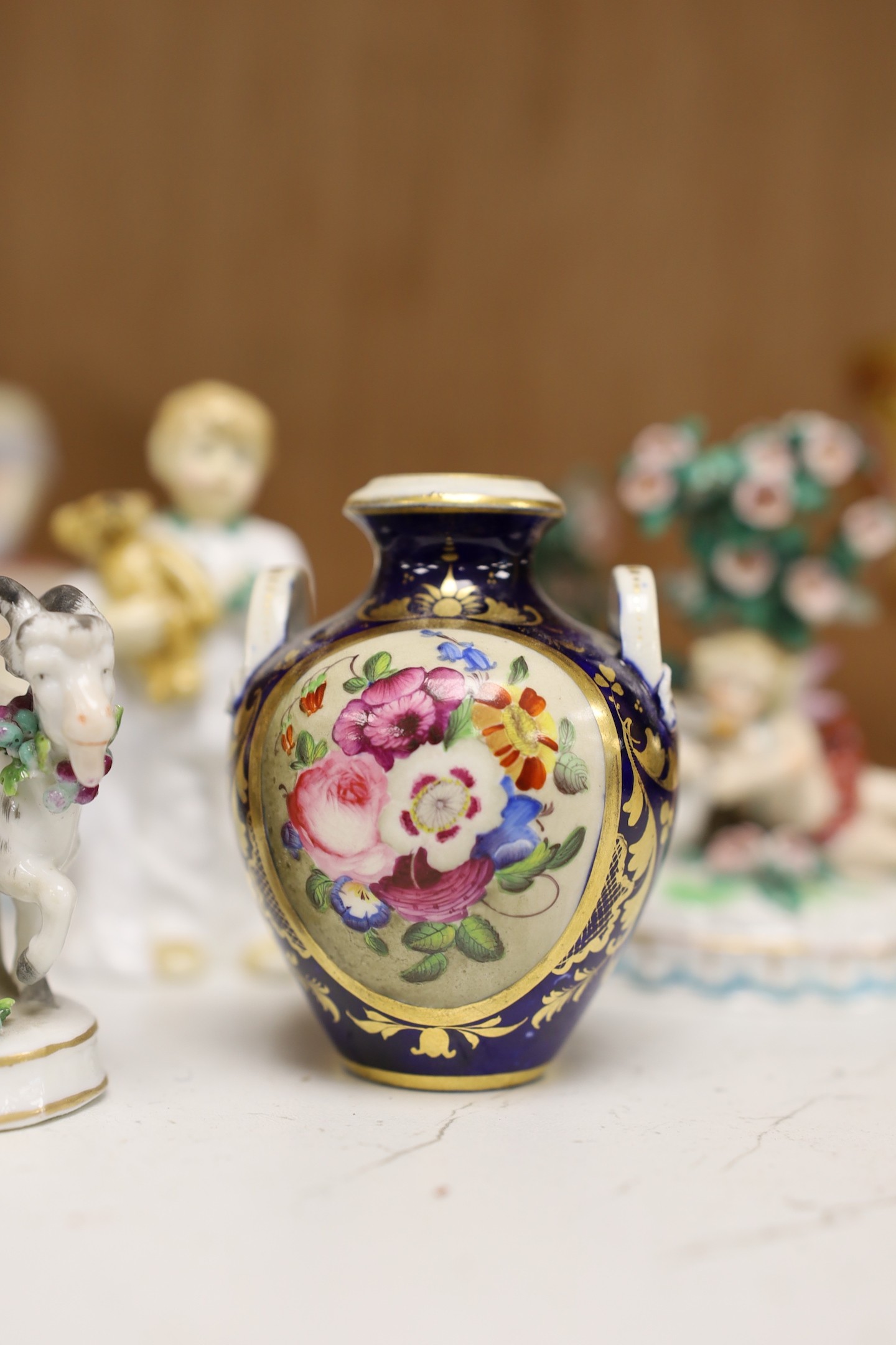A selection of various miniature ceramics and figurines, to include Royal Crown Derby two handled vases with central panelled section display of flower, together with Royal Doulton figures, tallest 19cm